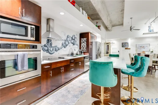 a living room with furniture and air hockey table
