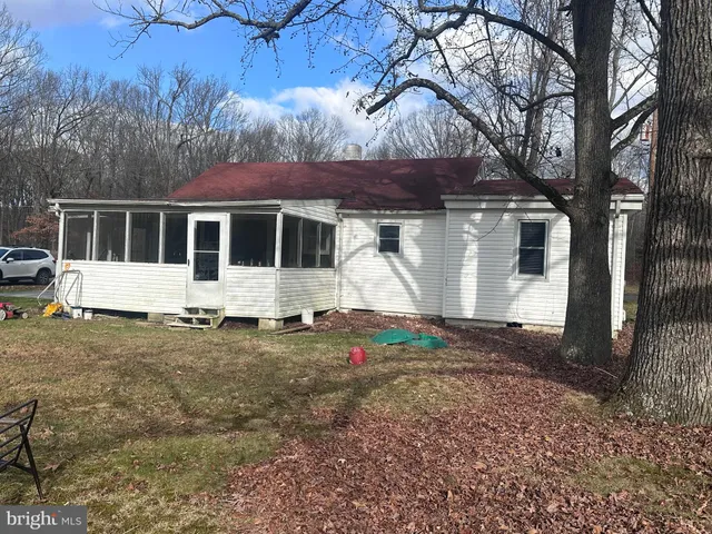a house with trees in the background