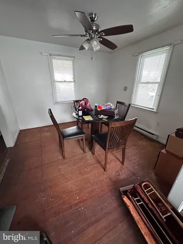 a living room with furniture rug and window