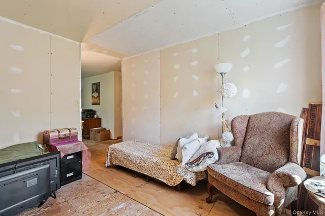 a bed room with a bed and a flat screen tv