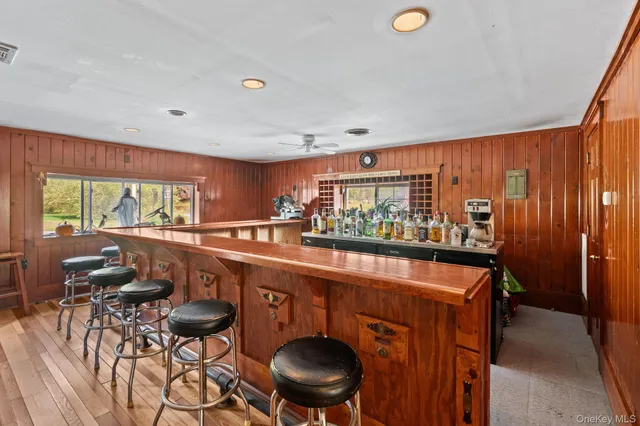 a view of a dining room with furniture wooden floor and chandelier