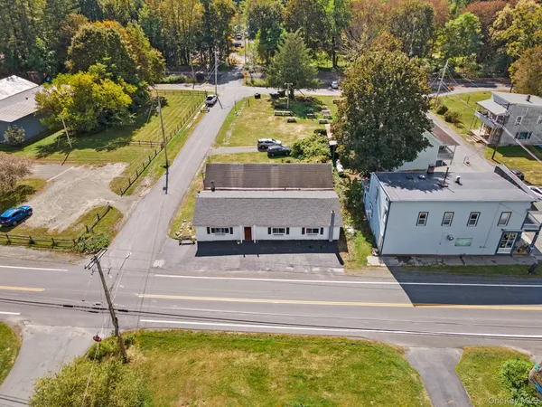 aerial view of a house with a yard