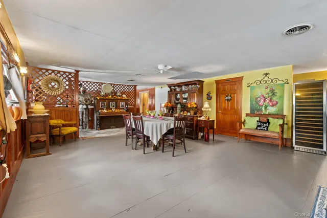 a view of a livingroom with furniture and a window