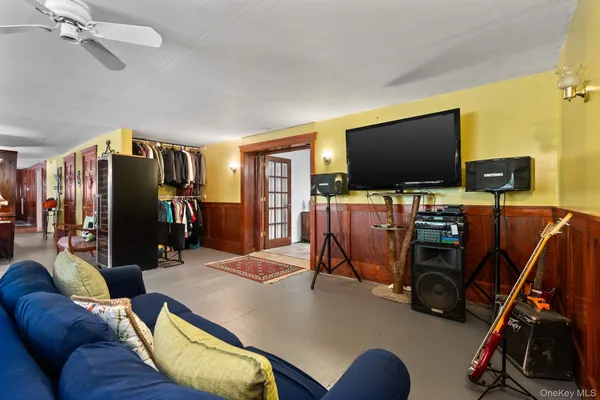 a view of a livingroom with furniture and a flat screen tv