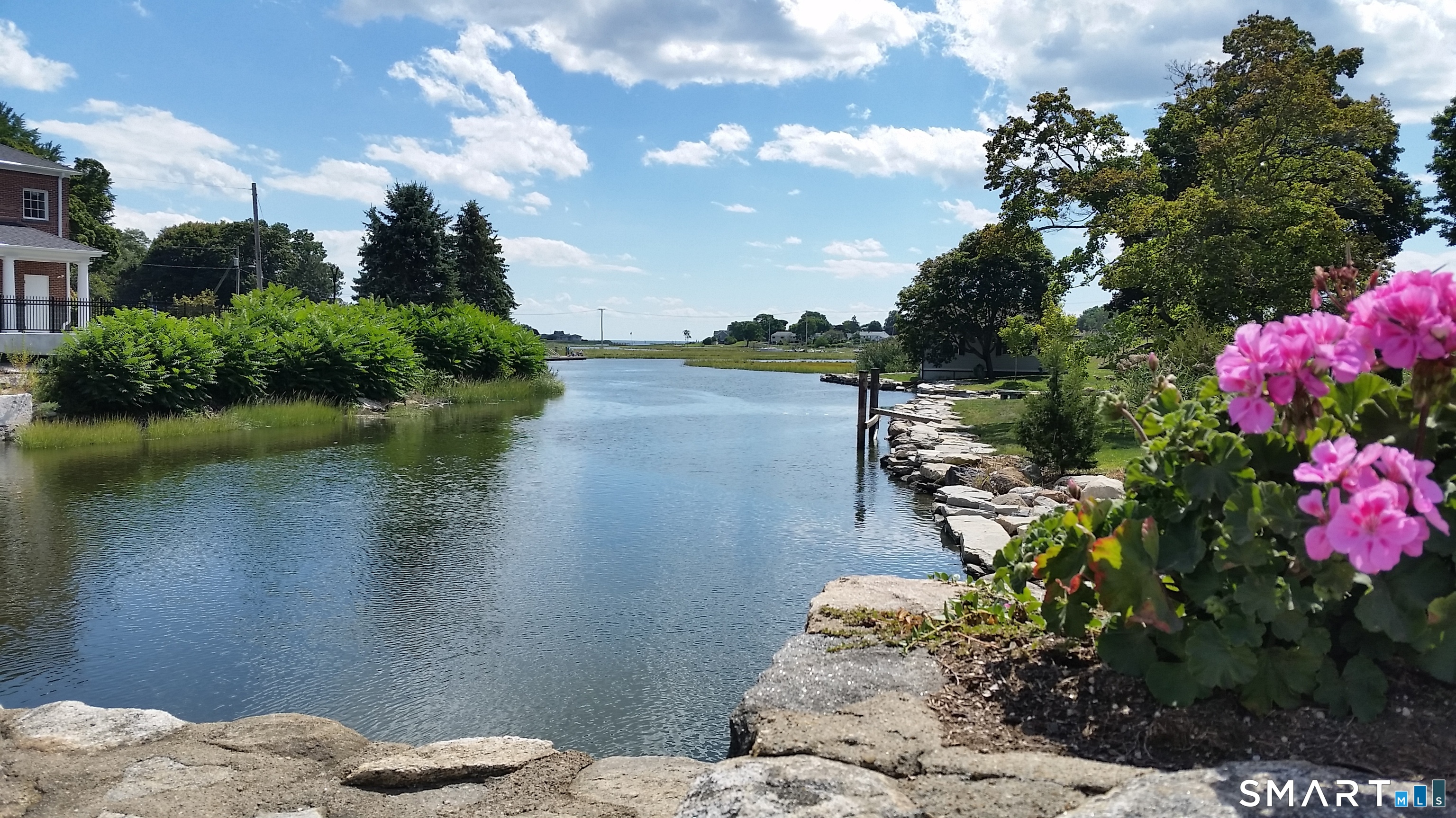 144 East Main Street, Unit 5 Clinton, CT 06413 - Photo 5 of 26 a view of a lake from a balcony
