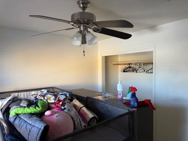 a bedroom with a bed and a couch