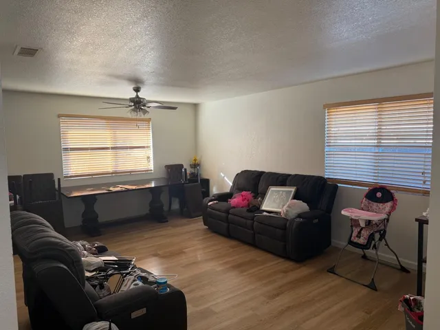 a living room with furniture and windows