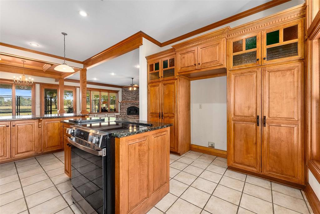 11631 Hiram Road Wills Point, TX 75169 - Photo 11 of 29 a kitchen with stainless steel appliances granite countertop a stove and a refrigerator