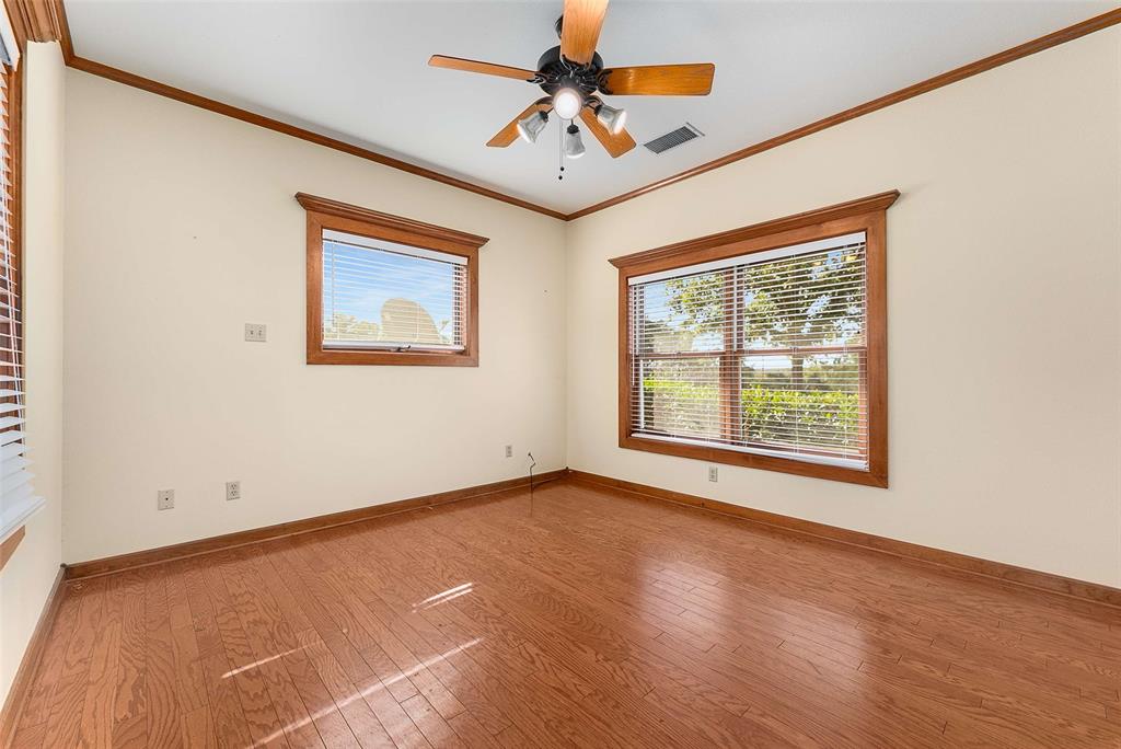 11631 Hiram Road Wills Point, TX 75169 - Photo 18 of 29 an empty room with a window and a ceiling fan