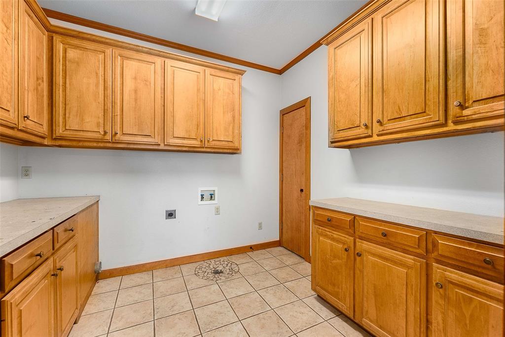 11631 Hiram Road Wills Point, TX 75169 - Photo 21 of 29 a view of a kitchen with granite countertop cabinets