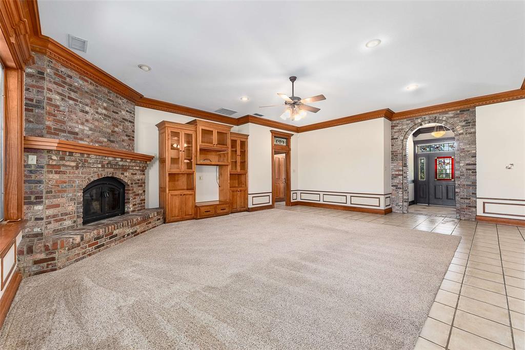 11631 Hiram Road Wills Point, TX 75169 - Photo 7 of 29 a view of an empty room with a fireplace