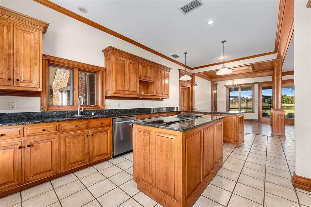 11631 Hiram Road Wills Point, TX 75169 - Photo 10 of 29 a kitchen with stainless steel appliances granite countertop a stove and a sink