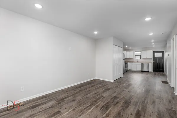 a view of kitchen with wooden floor