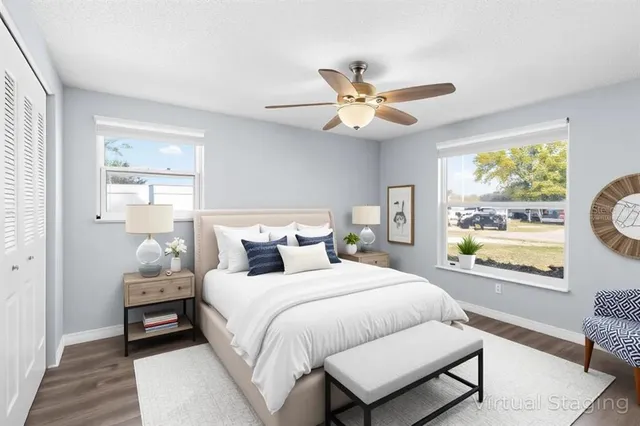 a bedroom with a bed and a window