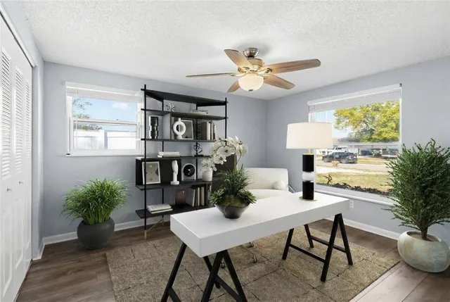 a view of a dining room with furniture window and wooden floor
