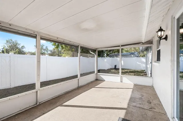 a bathroom with a glass door shower and yard