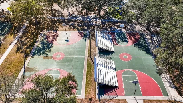 a view of a swimming pool with a table chairs and a swimming pool