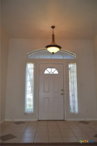 a view of a hallway with windows