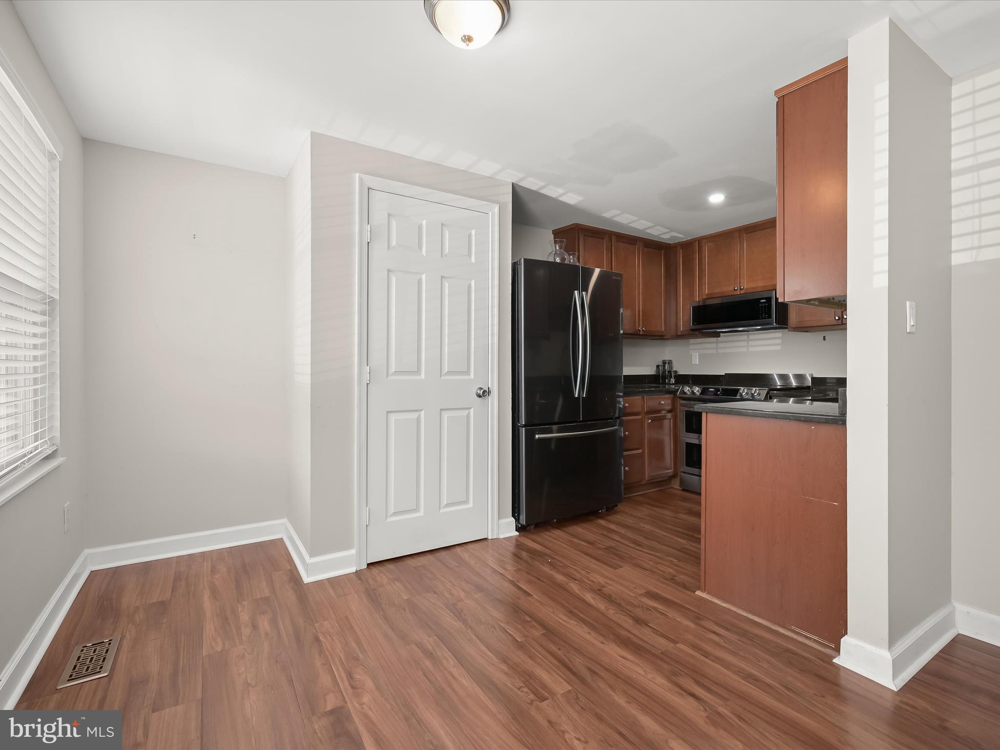 17617 Kohlhoss Road Poolesville, MD 20837 - Photo 11 of 48 a kitchen with stainless steel appliances a refrigerator and a stove top oven