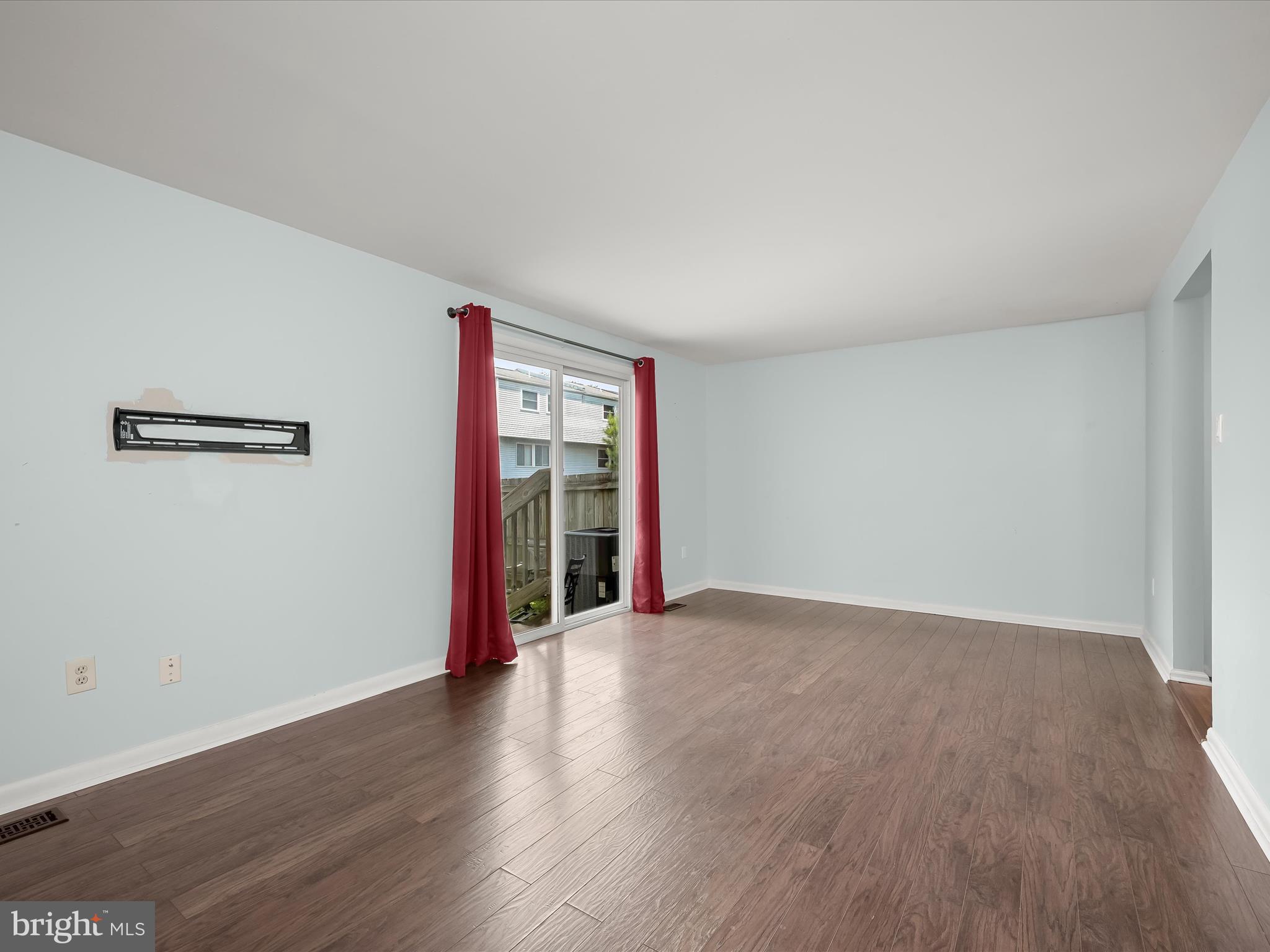 17617 Kohlhoss Road Poolesville, MD 20837 - Photo 21 of 48 an empty room with wooden floor and windows