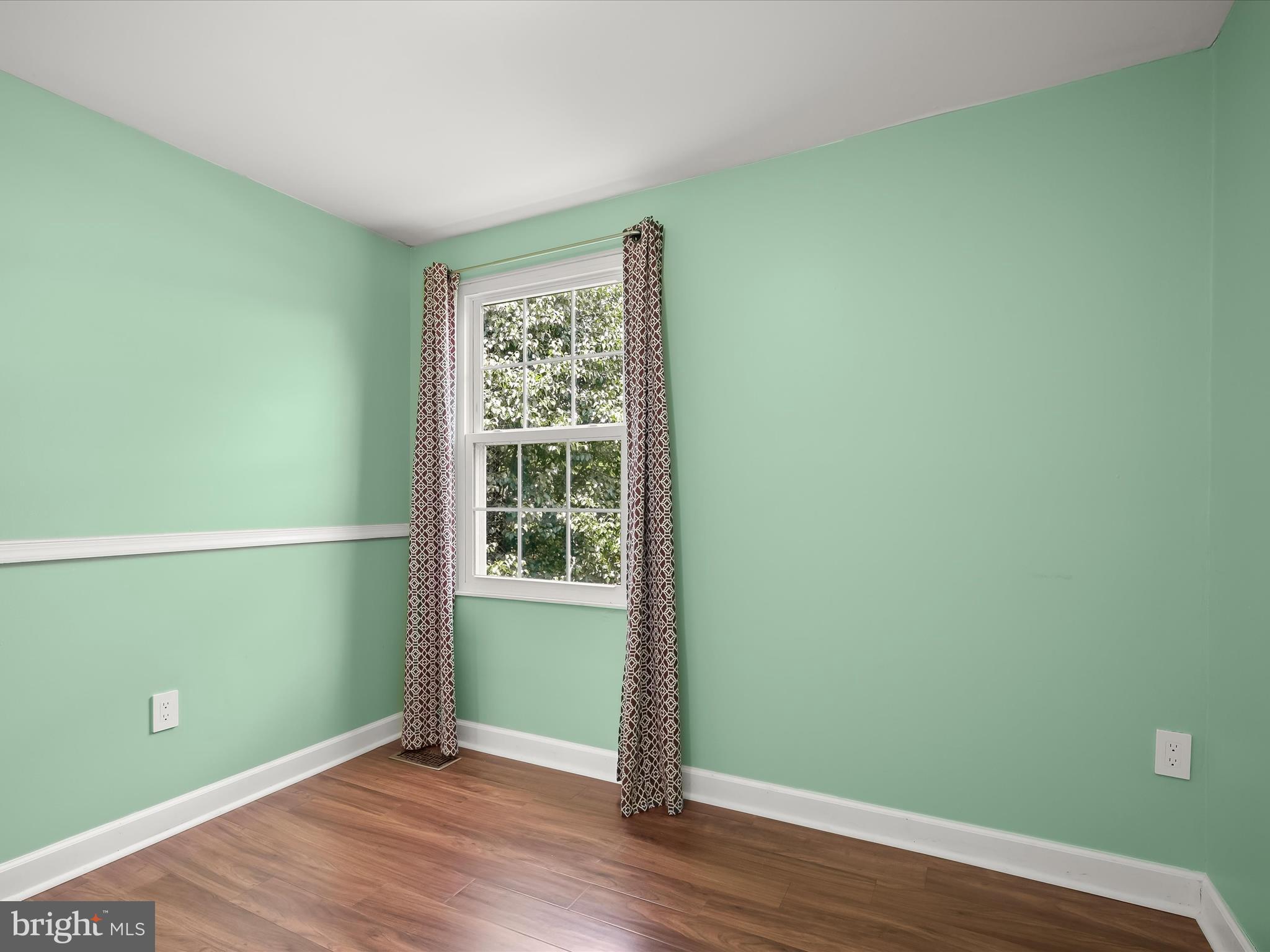 17617 Kohlhoss Road Poolesville, MD 20837 - Photo 28 of 48 a view of empty room with wooden floor and fan