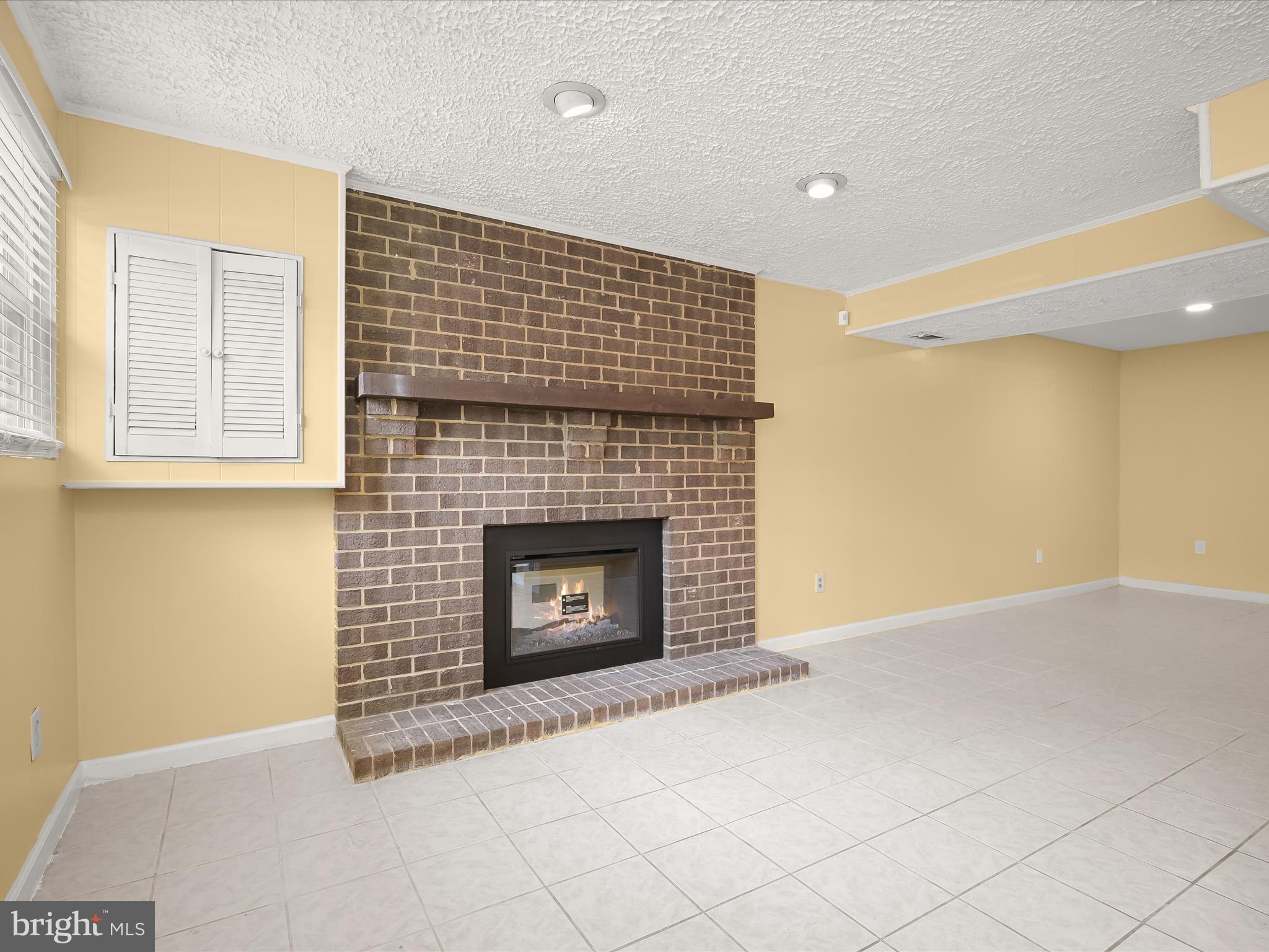 17617 Kohlhoss Road Poolesville, MD 20837 - Photo 38 of 48 a view of empty room with a fireplace