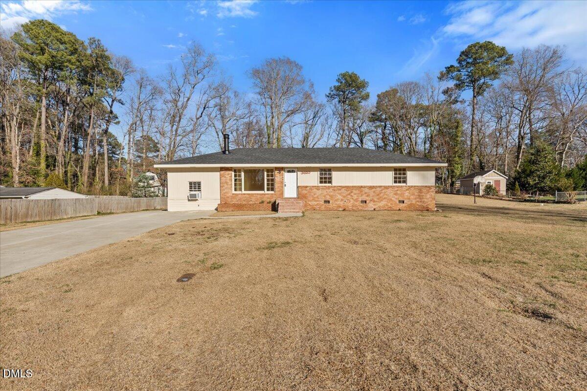 3620 Oates Drive Raleigh, NC 27604 - Photo 1 of 26 front view of house with a yard and trees