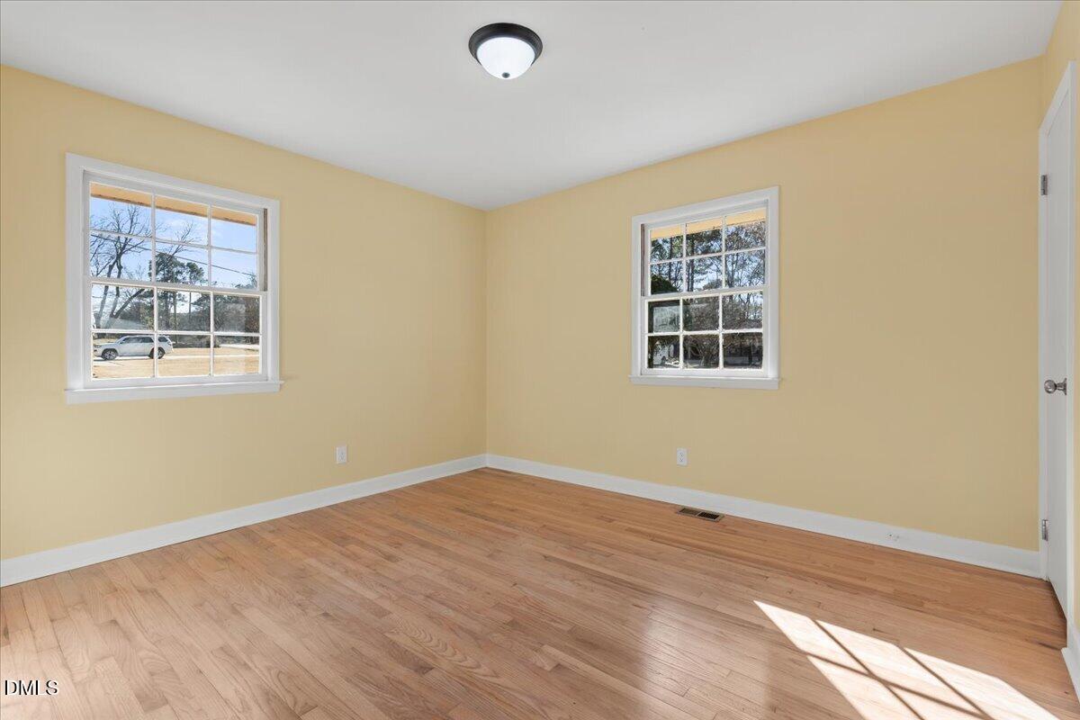 3620 Oates Drive Raleigh, NC 27604 - Photo 12 of 26 a view of a room with wooden floor and window
