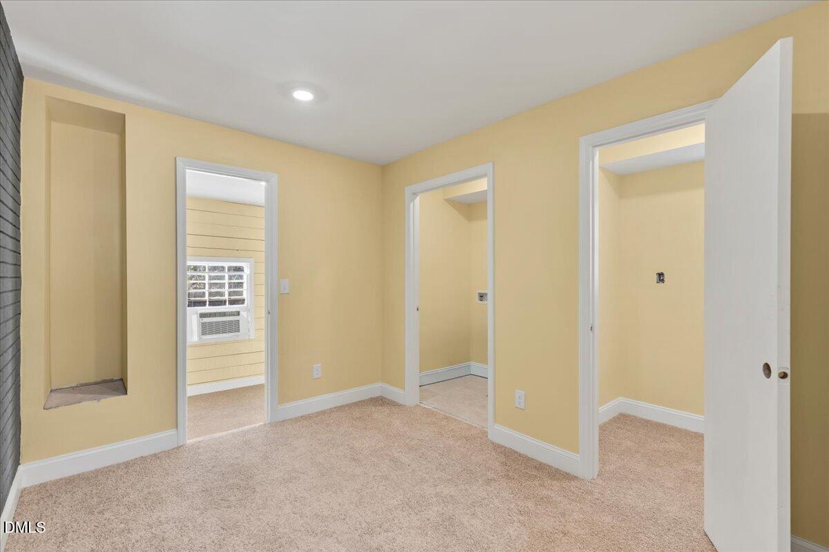 3620 Oates Drive Raleigh, NC 27604 - Photo 17 of 26 a view of livingroom with an empty space and a window