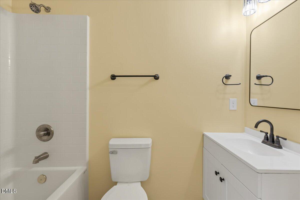3620 Oates Drive Raleigh, NC 27604 - Photo 19 of 26 a bathroom with a sink toilet and shower
