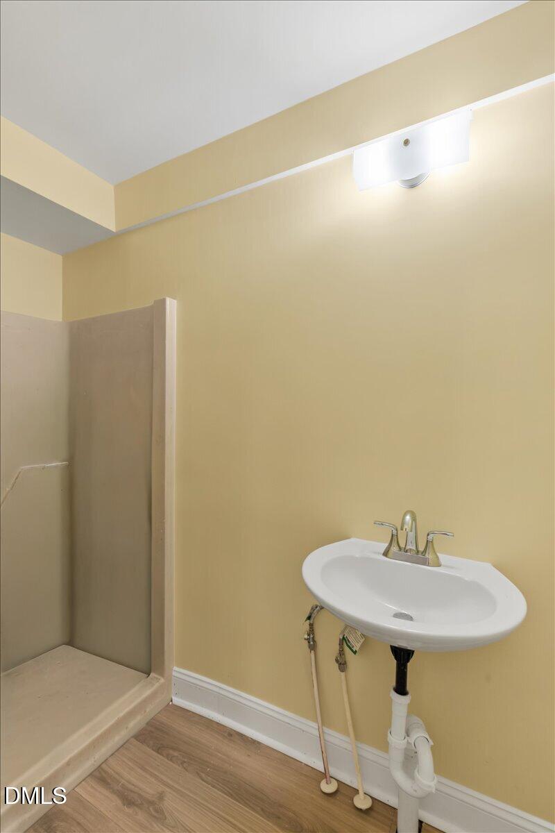 3620 Oates Drive Raleigh, NC 27604 - Photo 20 of 26 a bathroom with a sink and a mirror