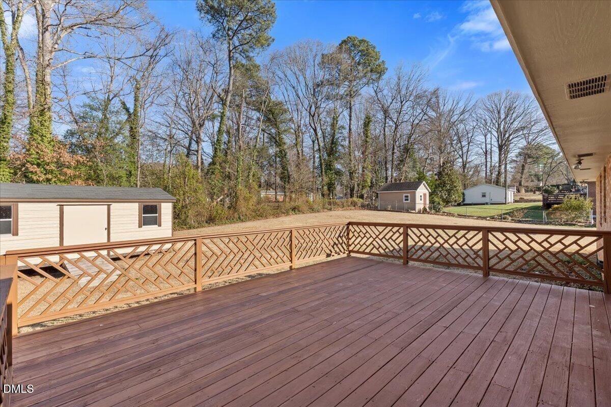 3620 Oates Drive Raleigh, NC 27604 - Photo 22 of 26 a view of a roof deck with wooden floor and fence
