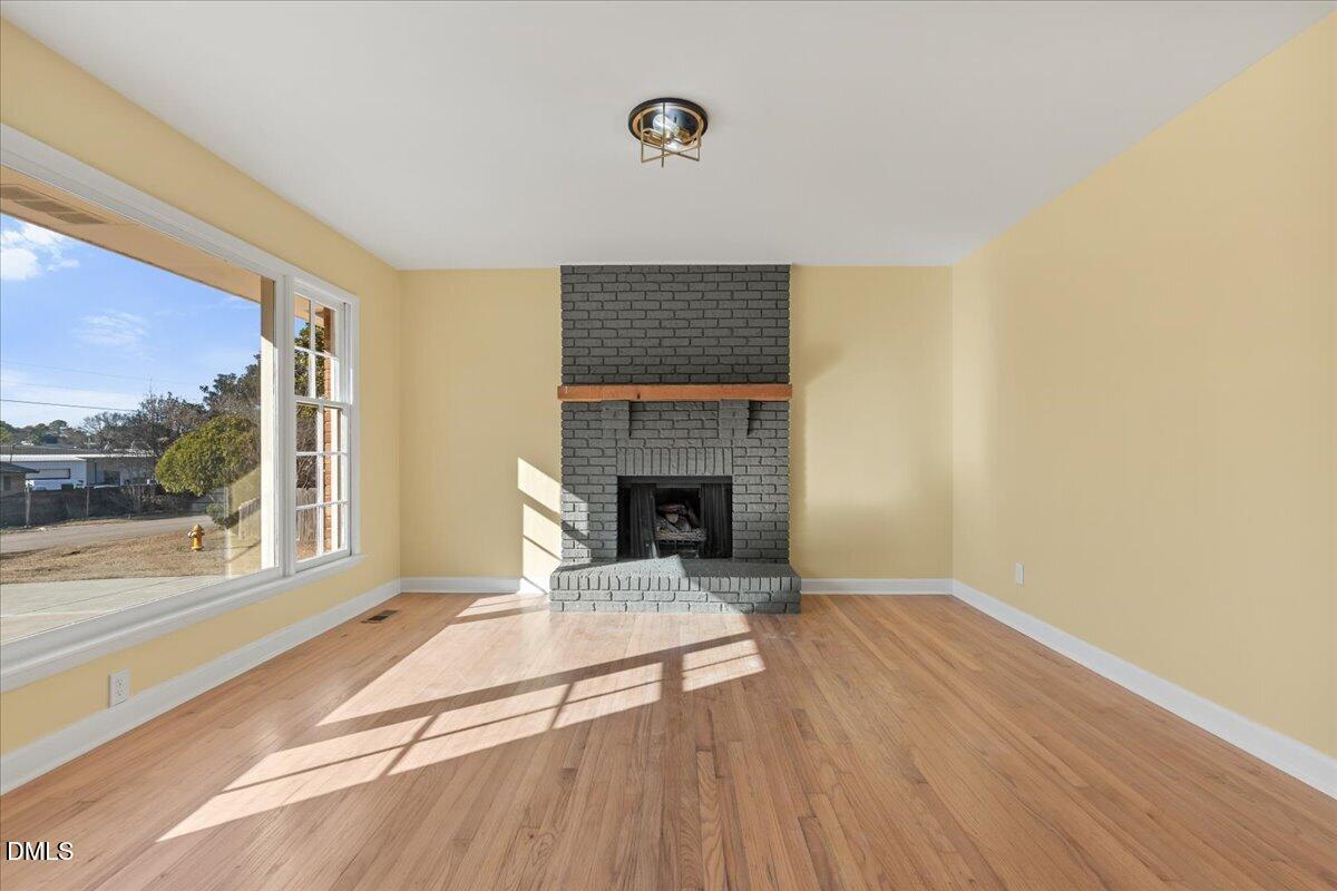 3620 Oates Drive Raleigh, NC 27604 - Photo 4 of 26 a living room with a fireplace and furniture