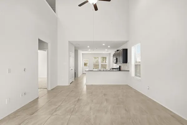 a view of a kitchen with a sink and a window