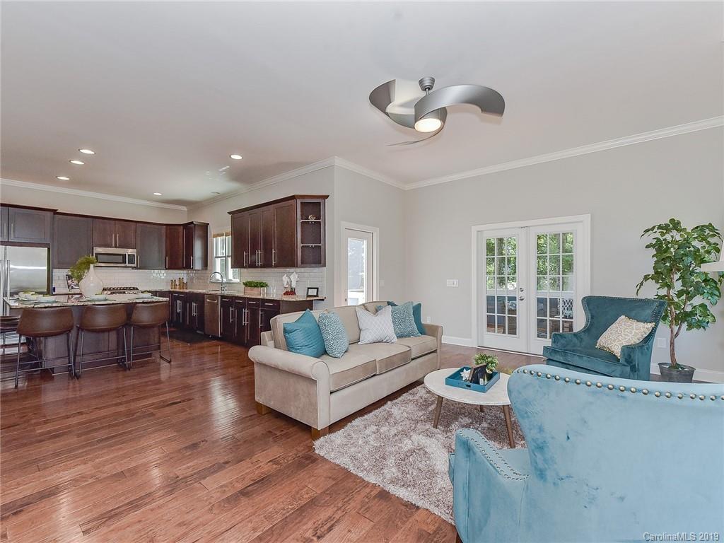 723 Harvest Pointe Drive Fort Mill, SC 29708 - Photo 16 of 47 a living room with furniture kitchen view and a large window