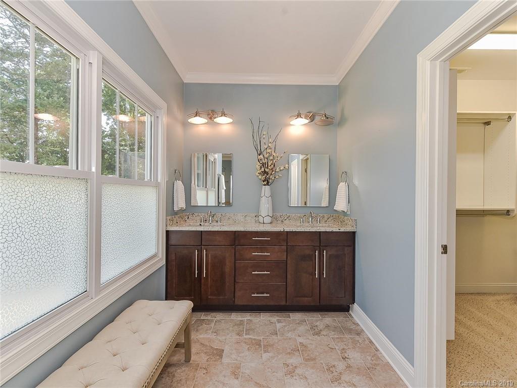 723 Harvest Pointe Drive Fort Mill, SC 29708 - Photo 25 of 47 a bathroom with a granite countertop sink a mirror and a vanity