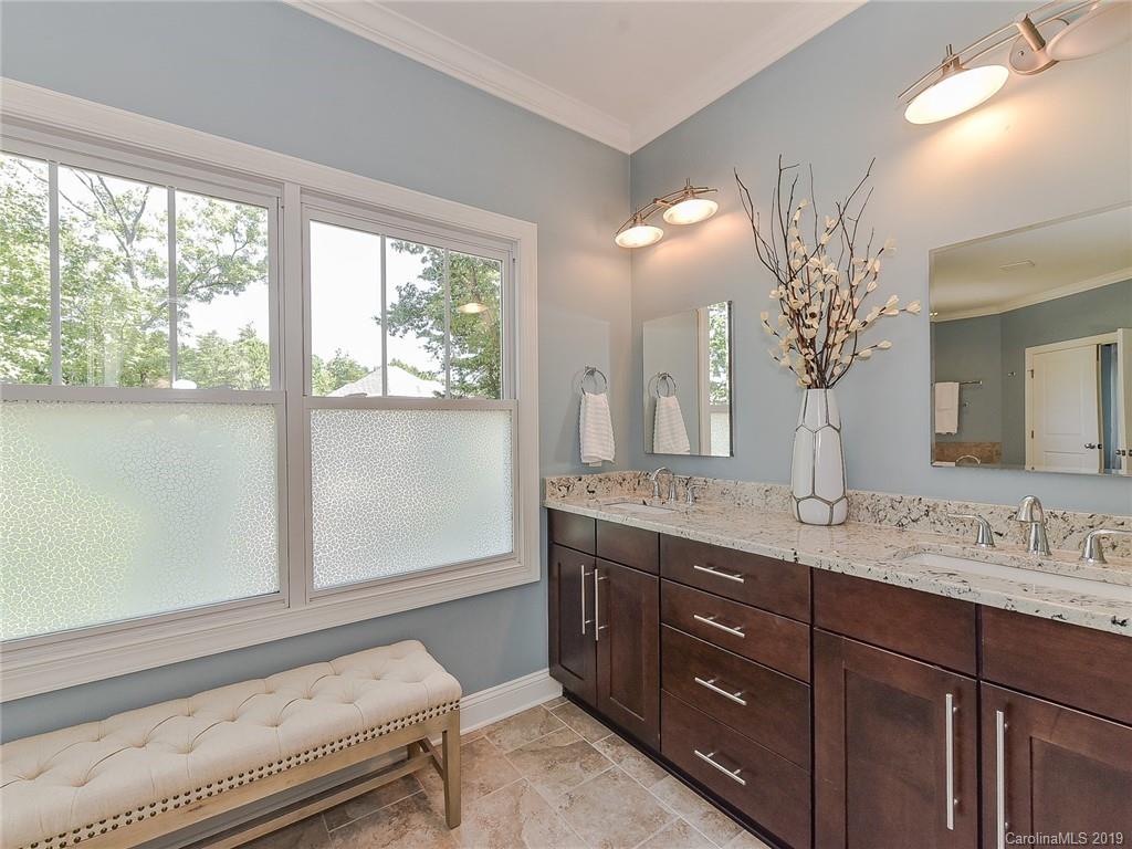 723 Harvest Pointe Drive Fort Mill, SC 29708 - Photo 26 of 47 a spacious bathroom with a granite countertop sink a large mirror and a vanity