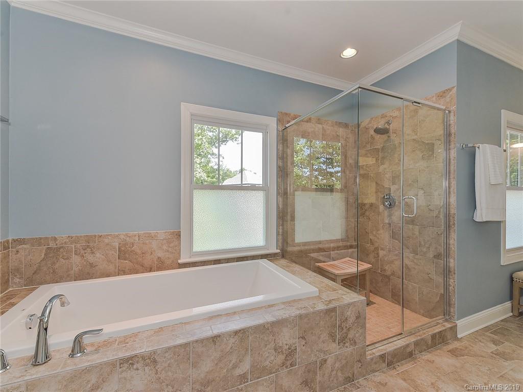 723 Harvest Pointe Drive Fort Mill, SC 29708 - Photo 27 of 47 a bathroom with a bathtub and shower