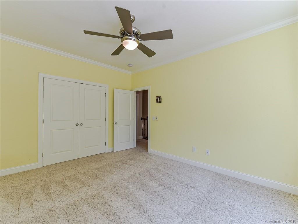 723 Harvest Pointe Drive Fort Mill, SC 29708 - Photo 29 of 47 an empty room with closet and fan