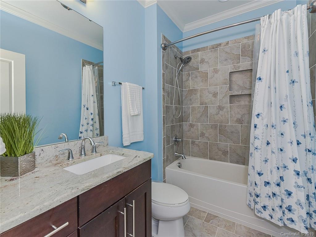 723 Harvest Pointe Drive Fort Mill, SC 29708 - Photo 30 of 47 a bathroom with a sink a toilet a mirror a bathtub and shower
