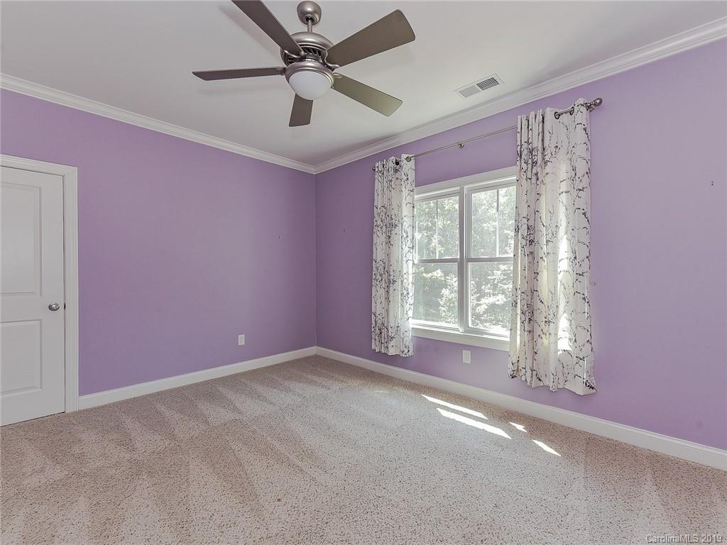 723 Harvest Pointe Drive Fort Mill, SC 29708 - Photo 31 of 47 a view of a livingroom with a ceiling fan and window