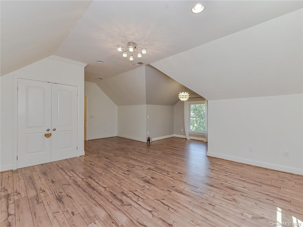 723 Harvest Pointe Drive Fort Mill, SC 29708 - Photo 33 of 47 a view of empty room with wooden floor and fan