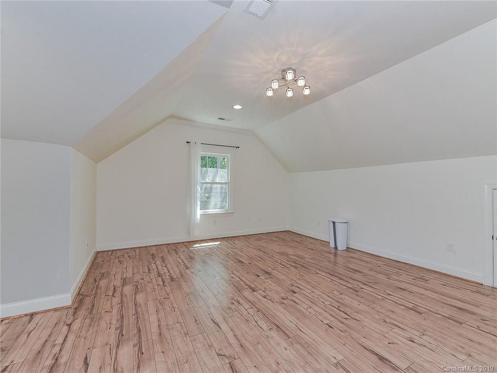 723 Harvest Pointe Drive Fort Mill, SC 29708 - Photo 34 of 47 an empty room with wooden floor and windows