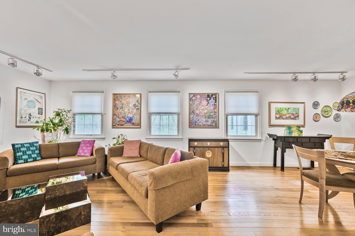2212 Washington Avenue, Unit 102 Silver Spring, MD 20910 - Photo 11 of 27 a living room with furniture and a wooden floor