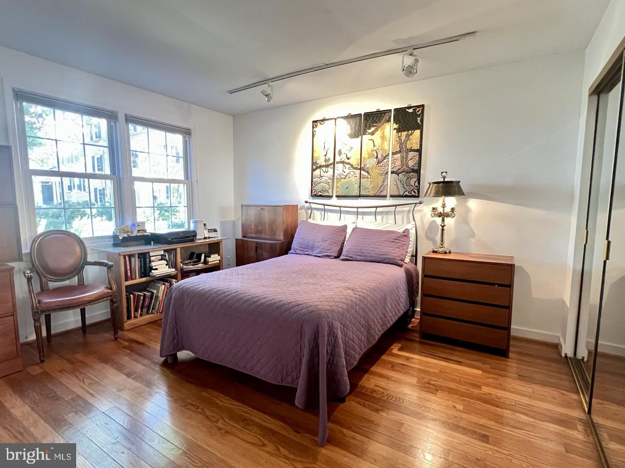 2212 Washington Avenue, Unit 102 Silver Spring, MD 20910 - Photo 12 of 27 a bedroom with a bed chair and a large window
