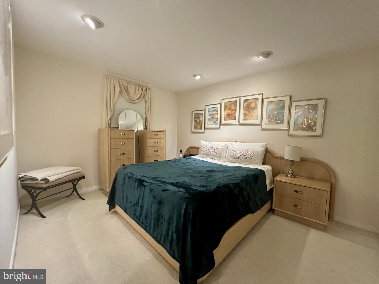 2212 Washington Avenue, Unit 102 Silver Spring, MD 20910 - Photo 19 of 27 a bedroom with a bed and dresser