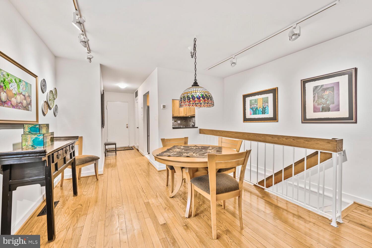 2212 Washington Avenue, Unit 102 Silver Spring, MD 20910 - Photo 2 of 27 a view of a dining room with furniture window and wooden floor
