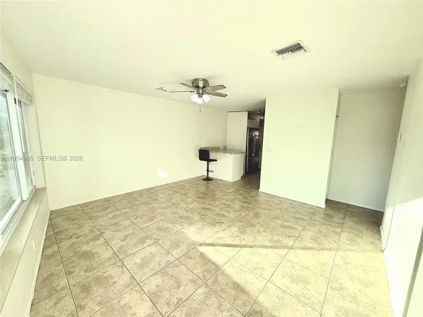 a view of a kitchen with a sink