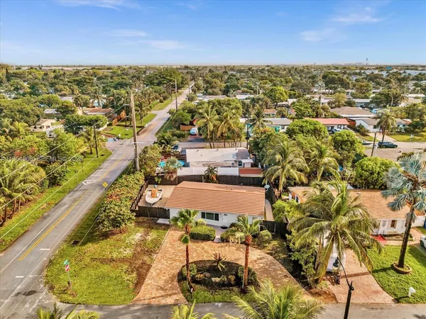 an aerial view of residential houses with outdoor space
