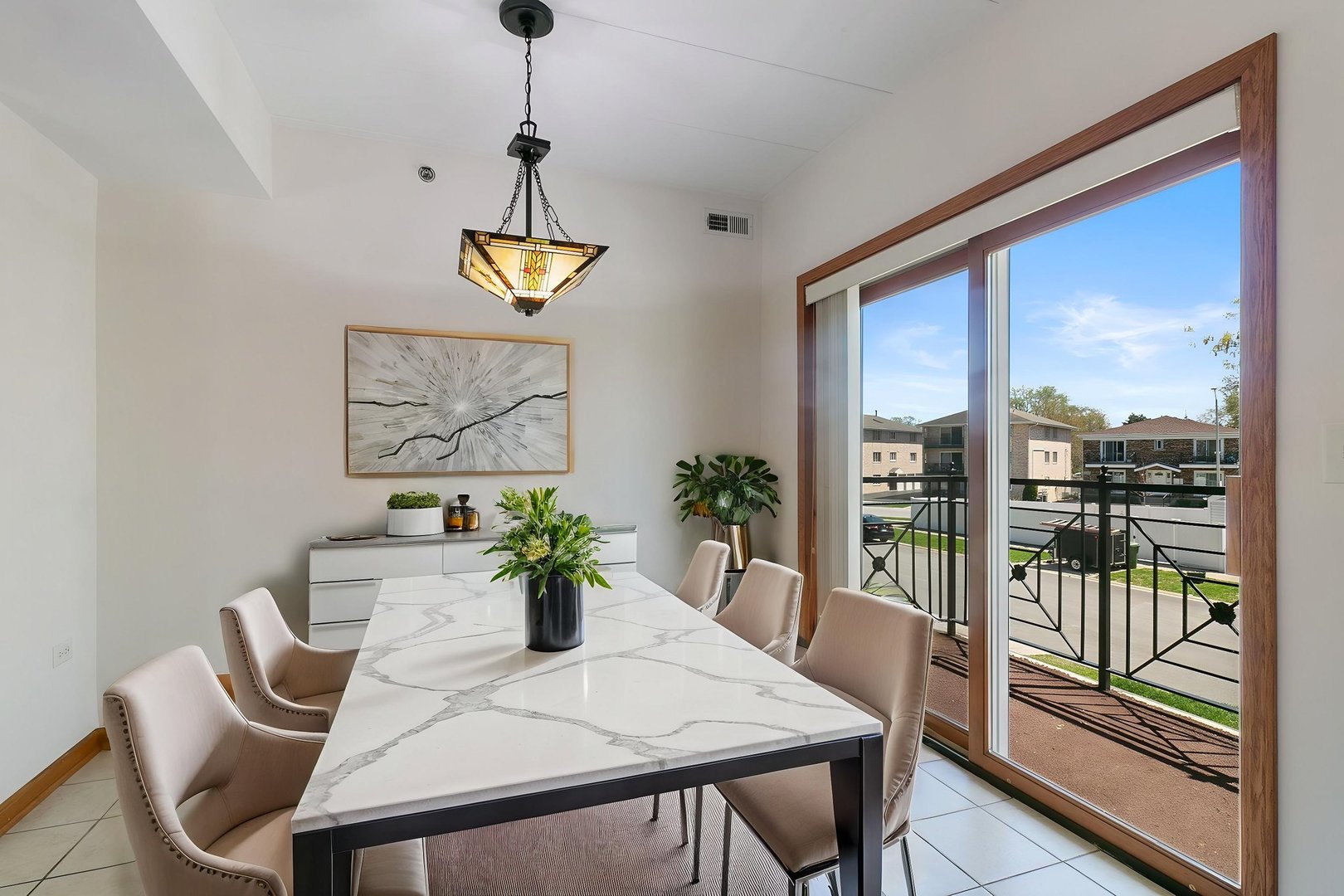 5368 West 96th Street, Unit 2S Oak Lawn, IL 60453 - Photo 2 of 18 a dining room with furniture a potted plant and a painting